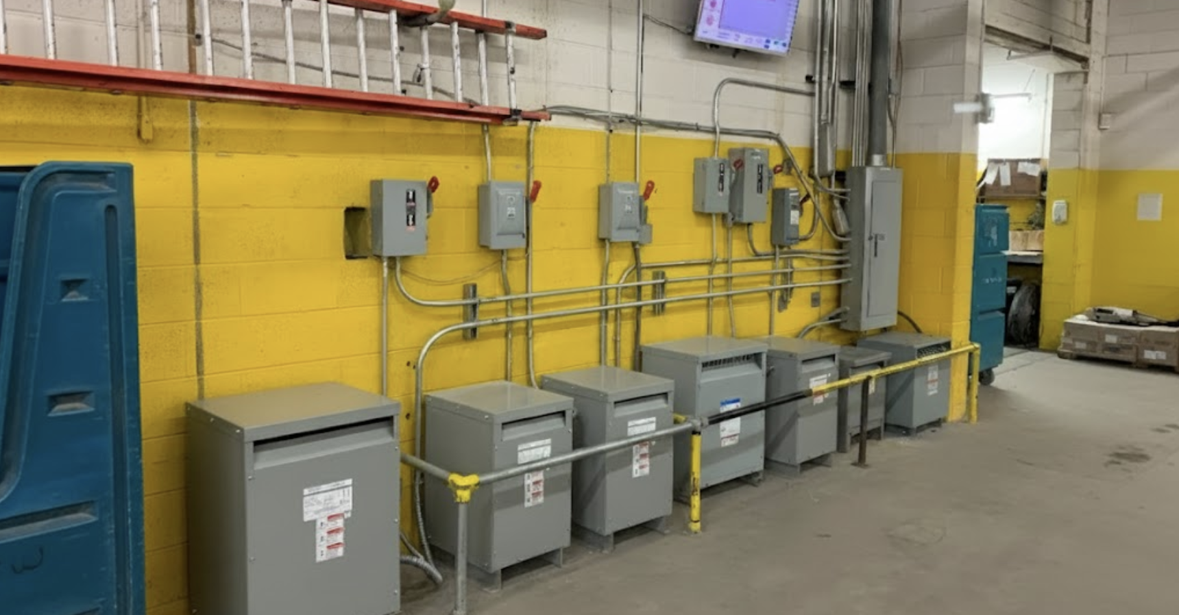 Commercial electrician performing electrical work in office building