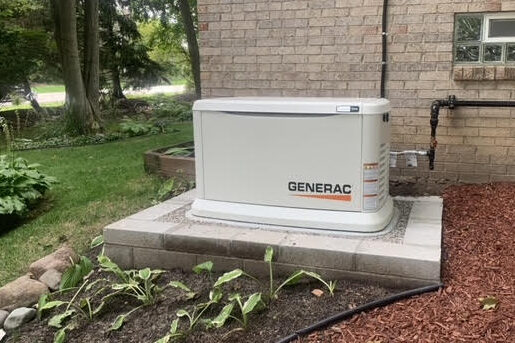 Completed Generac generator installation on concrete foundation